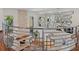 Elevated view of a bright living room with stone fireplace and modern decor at 2902 W Fair Oaks Ave, Tampa, FL 33611