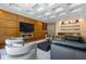 Contemporary living room with fireplace, custom shelving, and ample seating arrangements at 2902 W Fair Oaks Ave, Tampa, FL 33611
