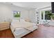 Bright bedroom featuring hardwood floors, a large window, and contemporary decor at 2902 W Fair Oaks Ave, Tampa, FL 33611