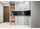 Pantry with plenty of cabinets and drawers with a modern black backsplash at 2902 W Fair Oaks Ave, Tampa, FL 33611