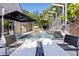 Stunning backyard pool area with modern fire table, perfect for outdoor entertaining and relaxation at 2902 W Fair Oaks Ave, Tampa, FL 33611