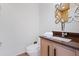 Modern powder room with stylish mirror, granite countertop, and sleek fixtures at 2902 W Fair Oaks Ave, Tampa, FL 33611