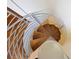 Elegant spiral staircase with wooden treads and a sleek metal railing, offering a modern design at 2902 W Fair Oaks Ave, Tampa, FL 33611
