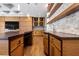 Modern wet bar area featuring custom wood cabinetry, stone backsplash, wine storage, and stylish countertops at 2902 W Fair Oaks Ave, Tampa, FL 33611