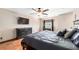 Comfortable bedroom with a large bed, hardwood floors, and neutral-colored walls at 2969 La Concha Dr, Clearwater, FL 33762