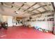 Spacious two car garage with red floor, laundry, and shelving at 2969 La Concha Dr, Clearwater, FL 33762