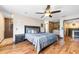 Stylish main bedroom with hardwood floors, a ceiling fan, and an en-suite bathroom at 2969 La Concha Dr, Clearwater, FL 33762