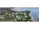 Aerial view of waterfront homes surrounded by lush trees along the bay at 300 S Florida Ave # 600L, Tarpon Springs, FL 34689
