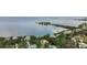 Stunning aerial view of waterfront homes nestled among lush trees, with bay views and a charming island at 300 S Florida Ave # 600L, Tarpon Springs, FL 34689