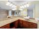 Bright bathroom vanity with double sinks, granite countertop, and ample lighting, perfect for modern living at 300 S Florida Ave # 600L, Tarpon Springs, FL 34689