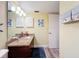 Bathroom features a sink, wooden cabinets, and marine-themed decor at 300 S Florida Ave # 600L, Tarpon Springs, FL 34689