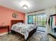 Bright bedroom featuring a balcony, stylish rug, and aquatic-themed decorations for a beachy, relaxing feel at 300 S Florida Ave # 600L, Tarpon Springs, FL 34689