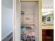 Linen closet next to the sink and features adjustable shelving for storage, as well as vanity in the bathroom at 300 S Florida Ave # 600L, Tarpon Springs, FL 34689