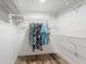 Spacious walk-in closet with white wire shelving, offering ample storage and organization options for clothing and accessories at 300 S Florida Ave # 600L, Tarpon Springs, FL 34689