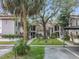 Well-maintained exterior with beautifully landscaped grounds and mature trees at 300 S Florida Ave # 600L, Tarpon Springs, FL 34689