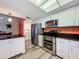 This kitchen features stainless steel appliances and white cabinets at 300 S Florida Ave # 600L, Tarpon Springs, FL 34689