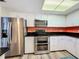 The kitchen has stainless steel appliances, a double oven, and white cabinets at 300 S Florida Ave # 600L, Tarpon Springs, FL 34689