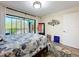 Main bedroom with sliding glass doors to lanai, ceiling fan, and neutral decor at 300 S Florida Ave # 600L, Tarpon Springs, FL 34689