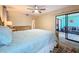The bedroom has wood floors and access to an enclosed patio at 300 S Florida Ave # 600L, Tarpon Springs, FL 34689