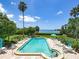 Inviting pool area surrounded by lush landscaping, perfect for relaxation and recreation under the sun and clear blue sky at 300 S Florida Ave # 600L, Tarpon Springs, FL 34689
