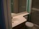 Practical bathroom features a vanity, toilet, and a glass-enclosed shower at 3077 Casa Del Sol Cir # 207, Clearwater, FL 33761