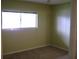 Bedroom featuring neutral paint, carpeted floors, and a window providing natural light at 3077 Casa Del Sol Cir # 207, Clearwater, FL 33761