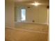 Bedroom featuring carpeted floors and a mirrored wall, creating a spacious feel at 3077 Casa Del Sol Cir # 207, Clearwater, FL 33761