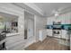 Open-concept kitchen with stainless appliances, white cabinetry, seamlessly connects to living area at 3114 Lake Pine Way # G1, Tarpon Springs, FL 34688