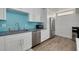 Well-lit kitchen featuring white cabinetry, stainless steel appliances and ample storage at 3114 Lake Pine Way # G1, Tarpon Springs, FL 34688
