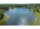 Scenic view of the lake, showcasing the water and surrounding greenery at 3114 Lake Pine Way # G1, Tarpon Springs, FL 34688