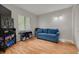 Bright living room with comfortable seating, a window, and modern decor at 3114 Lake Pine Way # G1, Tarpon Springs, FL 34688