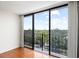 Expansive balcony offering breathtaking views of the city skyline, lush greenery, and bright blue skies at 3211 W Swann Avenue # 707, Tampa, FL 33609