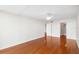 Bright bedroom features hardwood floors, ceiling fan, and ensuite bathroom at 3211 W Swann Avenue # 707, Tampa, FL 33609