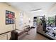 Bright fitness center featuring modern exercise equipment, carpeted floor, and natural light from large windows at 3211 W Swann Avenue # 707, Tampa, FL 33609