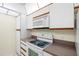 This kitchen showcases a white stove, microwave, matching cabinets, and countertop, ready for your culinary adventures at 3211 W Swann Avenue # 707, Tampa, FL 33609