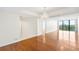 Bright living room with hardwood floors, chandelier, and large windows showcasing scenic city views at 3211 W Swann Avenue # 707, Tampa, FL 33609
