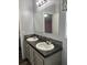 Bathroom with double sinks and neutral decor at 3221 Roxborough Ave, Clearwater, FL 33762
