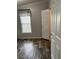 Bedroom with wood-look floors, natural light, and a neutral color palette at 3221 Roxborough Ave, Clearwater, FL 33762