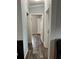Hallway with doors leading to different rooms at 3221 Roxborough Ave, Clearwater, FL 33762