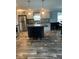 Modern kitchen featuring stainless steel appliances, a kitchen island, and sleek countertops at 3221 Roxborough Ave, Clearwater, FL 33762