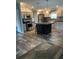 Modern kitchen featuring stainless steel appliances, a kitchen island, and sleek countertops at 3221 Roxborough Ave, Clearwater, FL 33762