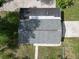 Aerial view of a house showing the roof and surrounding green space at 37045 North Ave, Dade City, FL 33523