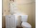 Bathroom showcasing a vanity, toilet, mirror, and shelf at 37045 North Ave, Dade City, FL 33523