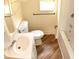 Bathroom with a vanity, toilet, bathtub, and modern fixtures at 37045 North Ave, Dade City, FL 33523