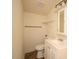 Bathroom showcasing a vanity, toilet, and shelf, designed for functionality at 37045 North Ave, Dade City, FL 33523