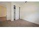 Carpeted bedroom features a closet with sliding doors at 37045 North Ave, Dade City, FL 33523