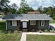Charming single-story home with a landscaped front yard and a welcoming entrance at 37045 North Ave, Dade City, FL 33523