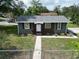 Charming single-story home boasts fresh paint, a new roof, and tidy landscaping at 37045 North Ave, Dade City, FL 33523