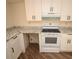 Kitchen featuring new white cabinets and modern appliances at 37045 North Ave, Dade City, FL 33523