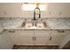 Close-up of kitchen featuring a double stainless steel sink and stylish countertops at 37045 North Ave, Dade City, FL 33523
